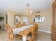 Charming dining room with wood table and pass-through to kitchen at 690 Island Way # 410, Clearwater Beach, FL 33767