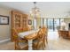 Bright dining room featuring a wood table and chandelier at 690 Island Way # 410, Clearwater Beach, FL 33767