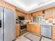 Modern kitchen featuring stainless steel appliances and light wood cabinets at 690 Island Way # 410, Clearwater Beach, FL 33767