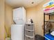 Convenient laundry room with washer, dryer, and storage at 690 Island Way # 410, Clearwater Beach, FL 33767