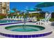 Relaxing spa and pool area with teal umbrellas at 690 Island Way # 410, Clearwater Beach, FL 33767