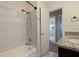 Simple bathroom with a tub shower combo and a view to bedroom at 7000 Dr Martin Luther King Jr S St, St Petersburg, FL 33705