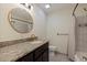 Bathroom with granite countertop and a tub shower combo at 7000 Dr Martin Luther King Jr S St, St Petersburg, FL 33705