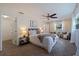 Spacious bedroom with ceiling fan, featuring a sitting area and ample closet space at 7000 Dr Martin Luther King Jr S St, St Petersburg, FL 33705