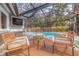 Relaxing pool area with covered patio and wicker furniture at 7000 Dr Martin Luther King Jr S St, St Petersburg, FL 33705