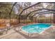 Enclosed screened pool area with lounge chairs at 7000 Dr Martin Luther King Jr S St, St Petersburg, FL 33705