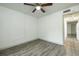 Bedroom with grey vinyl flooring and an interior door at 7117 E Bank Dr # 2, Tampa, FL 33617