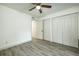 Bright bedroom with wood-look floors and ample closet space at 7117 E Bank Dr # 2, Tampa, FL 33617