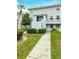 Building exterior showcasing entrance and landscaping at 7117 E Bank Dr # 2, Tampa, FL 33617