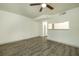 Spacious living room featuring grey vinyl flooring and a ceiling fan at 7117 E Bank Dr # 2, Tampa, FL 33617