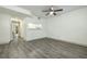 Bright living room with grey vinyl flooring and a kitchen pass-through at 7117 E Bank Dr # 2, Tampa, FL 33617