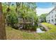 Tranquil pond reflecting the surrounding trees and buildings at 7117 E Bank Dr # 2, Tampa, FL 33617