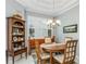 Bright dining room with wood table, chairs, and built-in hutch at 7304 Cleopatra Dr, Land O Lakes, FL 34637