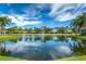 Scenic pond view with fountain and residential homes at 7304 Cleopatra Dr, Land O Lakes, FL 34637