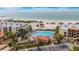 Aerial view of community pool and beach access at 7537 Bayshore Dr # 406, Treasure Island, FL 33706