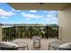 Balcony with water views and seating area at 7537 Bayshore Dr # 406, Treasure Island, FL 33706