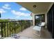 Relaxing balcony with outdoor seating and water views at 7537 Bayshore Dr # 406, Treasure Island, FL 33706