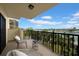 Spacious balcony with waterfront views and seating at 7537 Bayshore Dr # 406, Treasure Island, FL 33706