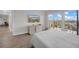 Bright bedroom with balcony access and built-in TV at 7537 Bayshore Dr # 406, Treasure Island, FL 33706