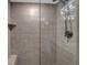 Large shower with glass enclosure and tiled walls at 7537 Bayshore Dr # 406, Treasure Island, FL 33706