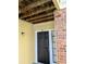 Condo front door with black finish and wood-beamed entryway at 8702 Mallard Reserve Dr # 104, Tampa, FL 33614