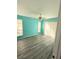 Main bedroom with light teal walls, ceiling fan, and sliding glass doors at 8702 Mallard Reserve Dr # 104, Tampa, FL 33614