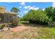 Large backyard with brick patio and mature landscaping at 1085 Indian Rocks S Rd, Largo, FL 33770