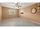 Empty bedroom with ceiling fan and window with blinds at 1085 Indian Rocks S Rd, Largo, FL 33770