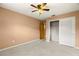 Spacious bedroom with ceiling fan and ample closet space at 1085 Indian Rocks S Rd, Largo, FL 33770
