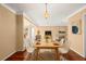 Dining room with hardwood floors, modern dining set, and view of living room at 1085 Indian Rocks S Rd, Largo, FL 33770