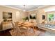 Dining room with hardwood floors, light-toned furniture, and a stylish chandelier at 1085 Indian Rocks S Rd, Largo, FL 33770