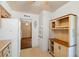 Kitchen boasting whitewashed brick and wood cabinets at 1085 Indian Rocks S Rd, Largo, FL 33770