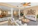 Living room featuring comfy sofas, coffee table, and built-in shelving at 1085 Indian Rocks S Rd, Largo, FL 33770