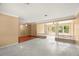 Large living room with hardwood floors and a view into the adjacent dining area at 1085 Indian Rocks S Rd, Largo, FL 33770