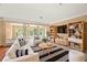 Living area showcasing stylish sofas, rug and a large TV at 1085 Indian Rocks S Rd, Largo, FL 33770