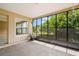 Screened porch with view of backyard and trees at 1085 Indian Rocks S Rd, Largo, FL 33770