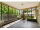 Bright screened porch with view of backyard at 1085 Indian Rocks S Rd, Largo, FL 33770