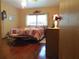 Bedroom with a patchwork quilt and wood floors at 109 Florida Ave, Brooksville, FL 34601