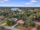 Aerial view showcasing home's location near a lake at 11097 Golden Eagle Ave, Weeki Wachee, FL 34613