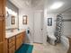 Bathroom features wood cabinets, a bathtub and shower at 12300 Vonn Rd # 6101, Largo, FL 33774