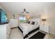 Main bedroom with a king-size bed and white dresser at 12300 Vonn Rd # 6101, Largo, FL 33774