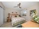 Relaxing bedroom with floral bedding and plenty of natural light at 12300 Vonn Rd # 6101, Largo, FL 33774