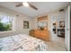 Charming bedroom with floral bedding and built-in dresser at 12300 Vonn Rd # 6101, Largo, FL 33774