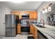 Condo kitchen with granite counters and stainless steel appliances at 12300 Vonn Rd # 6101, Largo, FL 33774