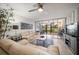 Bright living room with comfortable seating and sliding glass doors leading to a patio at 12300 Vonn Rd # 6101, Largo, FL 33774
