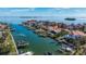 Aerial view of waterfront home with private dock and boat slips at 127 Sands Point Dr, Tierra Verde, FL 33715