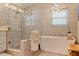 Spa-like bathroom with soaking tub and walk-in shower at 127 Sands Point Dr, Tierra Verde, FL 33715