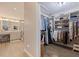 Large walk-in closet with ample shelving and hanging space at 127 Sands Point Dr, Tierra Verde, FL 33715