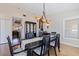 Elegant dining room features a chandelier and hardwood floors at 127 Sands Point Dr, Tierra Verde, FL 33715