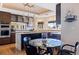 Eat-in kitchen with granite counters, island, and stainless appliances at 127 Sands Point Dr, Tierra Verde, FL 33715